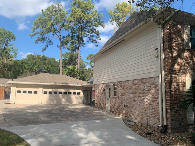 view of side of home featuring a garage