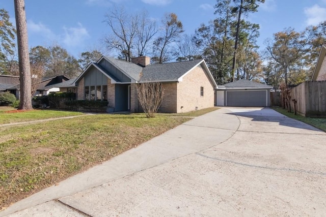 single story home featuring a garage and a front lawn