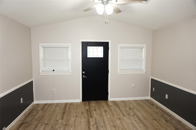 foyer entrance with hardwood / wood-style floors, ceiling fan, and lofted ceiling