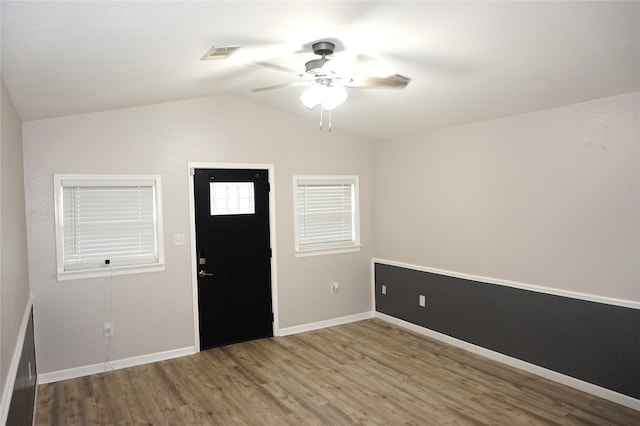 entrance foyer featuring ceiling fan, hardwood / wood-style floors, and lofted ceiling