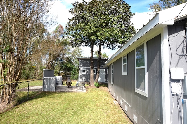 view of yard with an outdoor structure and a patio