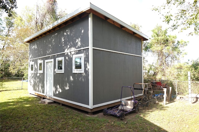 view of outdoor structure with a yard