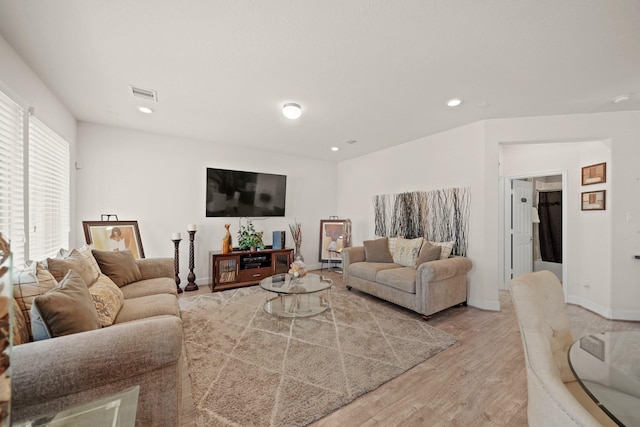 living room with light hardwood / wood-style flooring