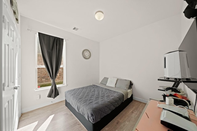 bedroom featuring light hardwood / wood-style floors