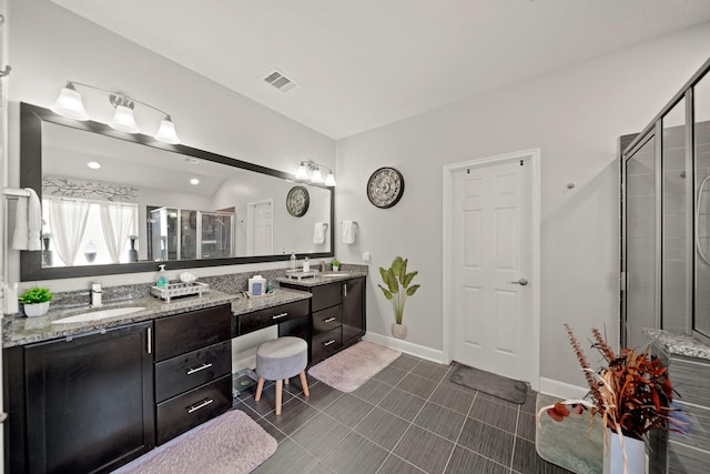 bathroom with vanity and an enclosed shower