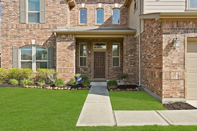 doorway to property with a lawn