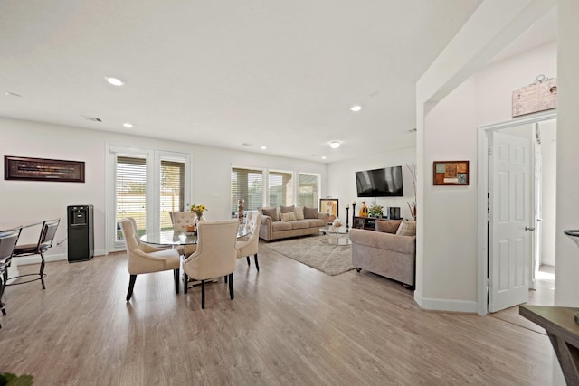 dining area with light hardwood / wood-style floors