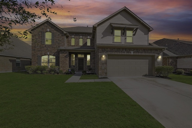 view of front facade featuring a lawn and a garage