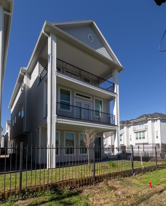 view of front of house featuring a balcony