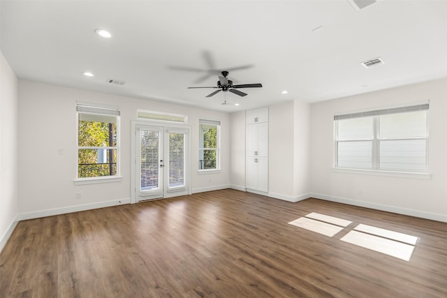 unfurnished room featuring french doors, dark hardwood / wood-style floors, and ceiling fan