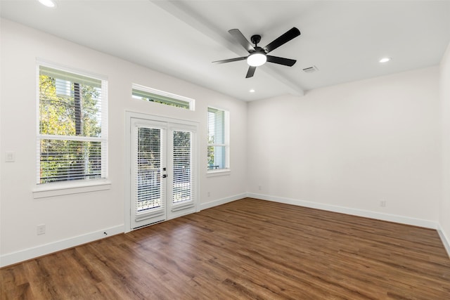 spare room featuring dark hardwood / wood-style flooring, ceiling fan, and french doors