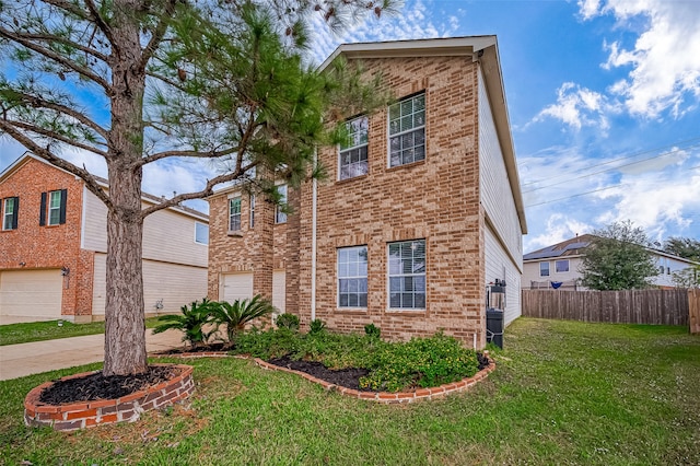 view of front of property with a front lawn and a garage