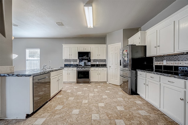 kitchen with decorative backsplash, white cabinetry, and stainless steel appliances