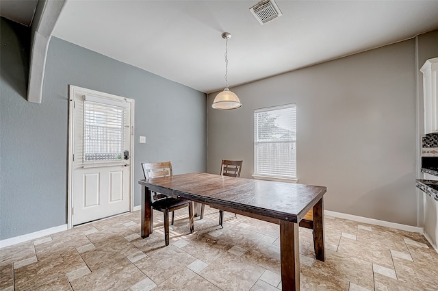 dining room with plenty of natural light