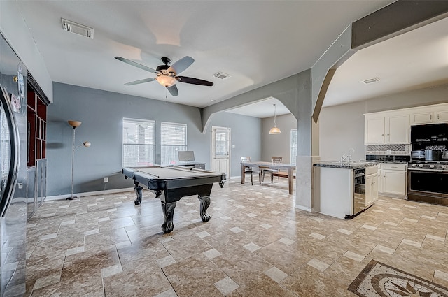 playroom with ceiling fan and pool table