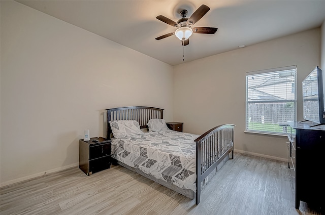 bedroom featuring ceiling fan and light hardwood / wood-style floors