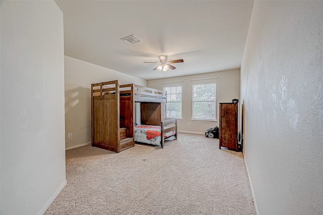 bedroom with light colored carpet and ceiling fan