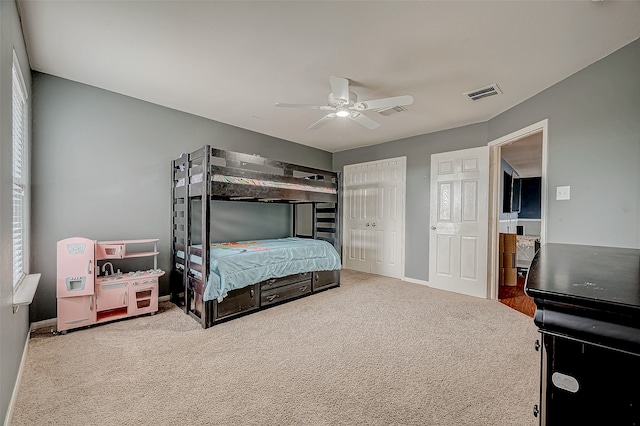 carpeted bedroom with ceiling fan