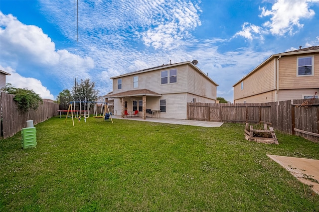 rear view of property with a patio, a playground, and a lawn