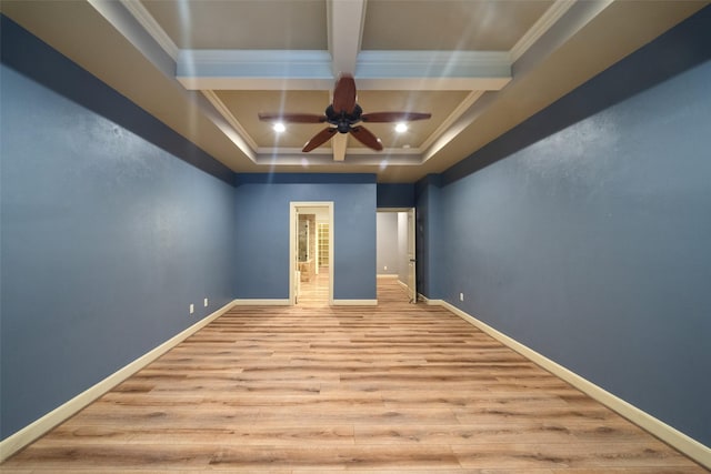 unfurnished room featuring ceiling fan, light hardwood / wood-style flooring, beamed ceiling, crown molding, and a tray ceiling