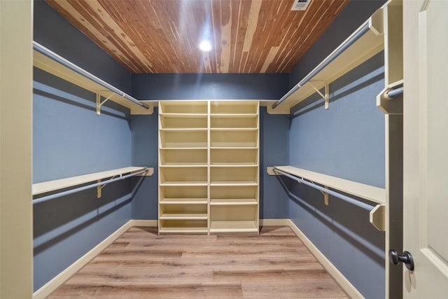 walk in closet featuring hardwood / wood-style floors