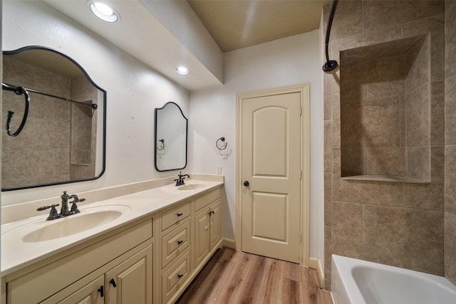 bathroom with hardwood / wood-style floors and vanity