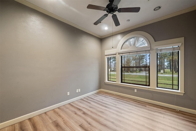 spare room featuring ceiling fan, crown molding, and light hardwood / wood-style flooring