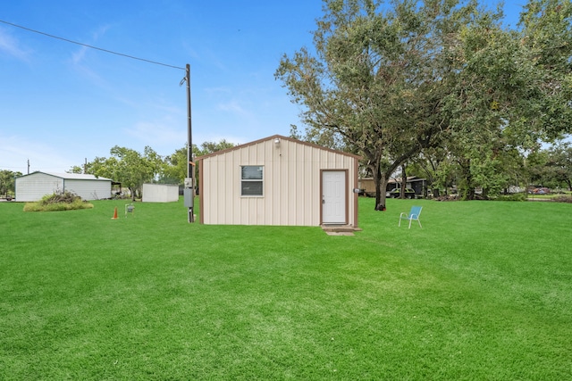 view of outbuilding with a lawn