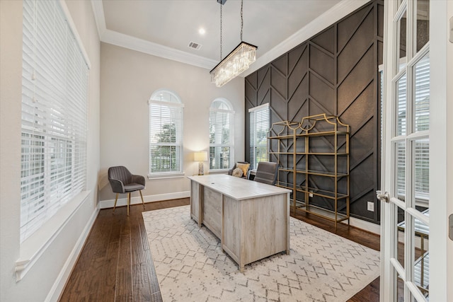 office area with wood-type flooring, crown molding, and a notable chandelier