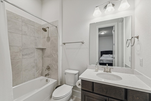 full bathroom featuring shower / tub combo with curtain, vanity, and toilet