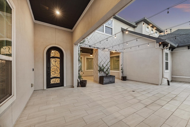 view of patio terrace at dusk