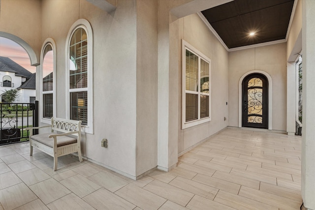 exterior entry at dusk with a porch