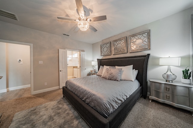 carpeted bedroom featuring connected bathroom and ceiling fan