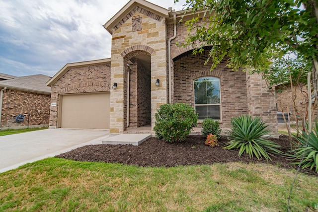 view of front of property with a garage