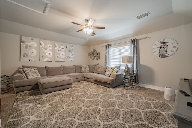 living room with carpet floors, vaulted ceiling, and ceiling fan