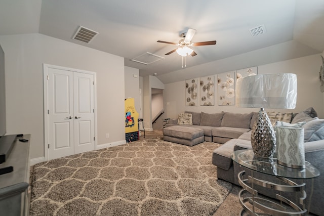 living room with carpet floors, vaulted ceiling, and ceiling fan