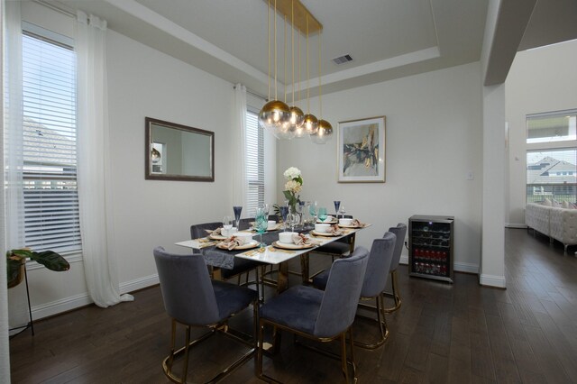 dining area featuring dark hardwood / wood-style flooring and wine cooler