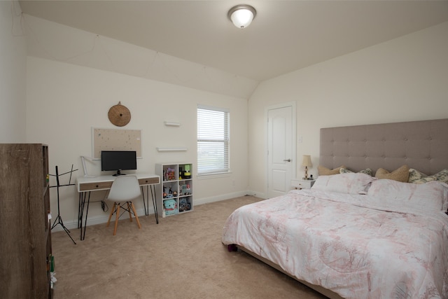 carpeted bedroom with vaulted ceiling