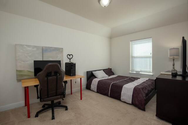 bedroom featuring light colored carpet