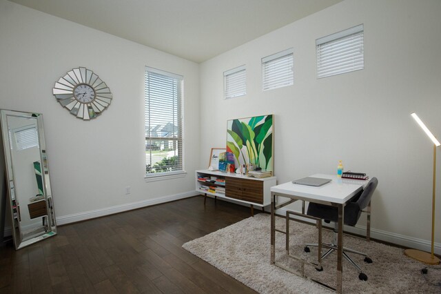 office space with dark wood-type flooring