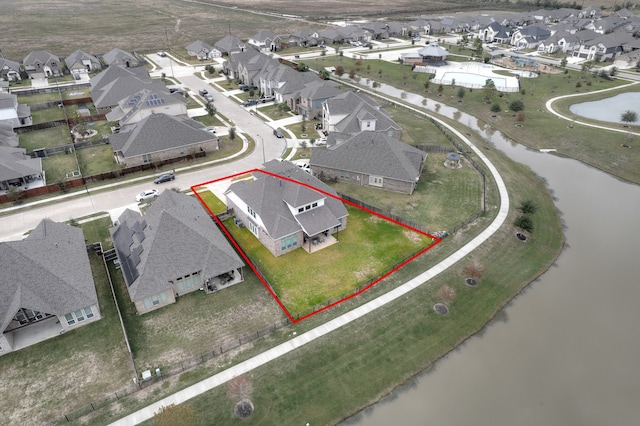 birds eye view of property featuring a water view