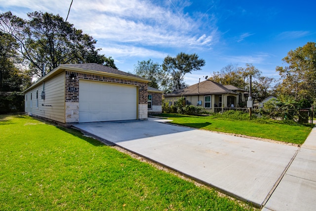 ranch-style house featuring a front yard and a garage