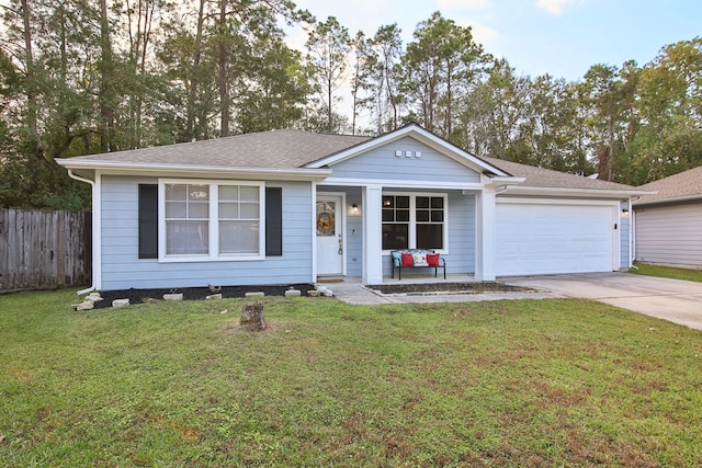 single story home with a garage and a front yard