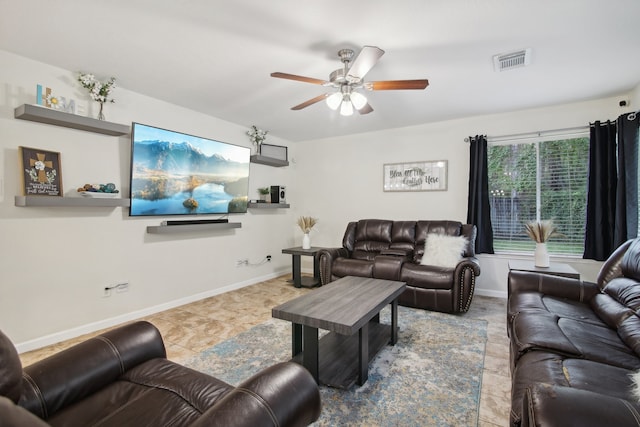 tiled living room featuring ceiling fan