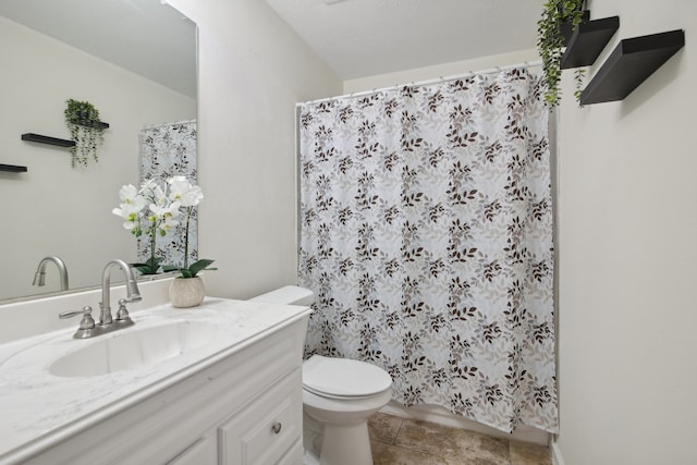 bathroom with tile patterned floors, vanity, and toilet