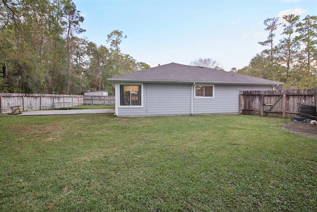 rear view of house with a yard