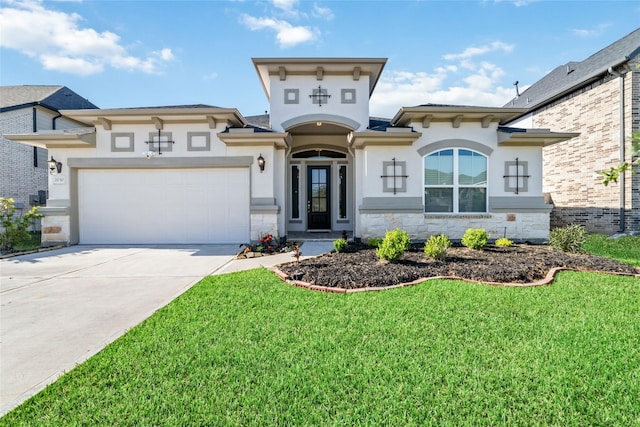 view of front of home with a front yard and a garage