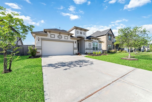 view of front of home featuring a garage and a front yard