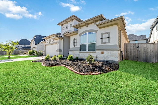 view of front of property featuring a front lawn and a garage