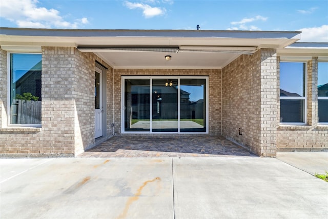 doorway to property with a patio